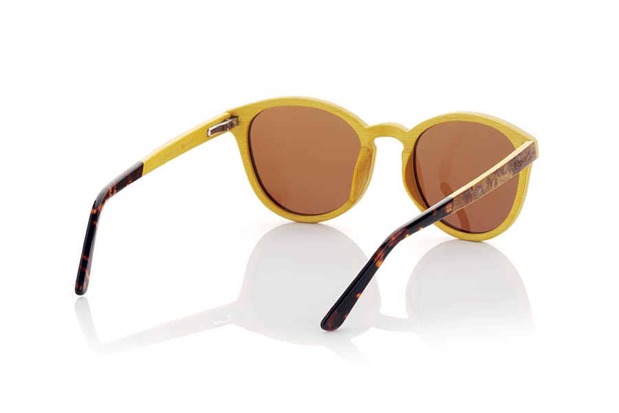 Wood eyewear of Burr LUAI. LUAI wooden sunglasses are an exceptionally elegant model, with a frame and temples made of Burr laminated wood on the outside and beige maple on the inside, giving it a unique marbled look. The temples are finished in acetate and are adjustable, allowing for a comfortable and secure fit. With its rounded shape, these glasses are versatile and adapt to any style and gender. Solid lenses offer exceptional protection from the sun's rays, while their classic styling ensures you'll always be in style. With Luai sunglasses, you will enjoy the sun in style and with superior protection. Front measurement: 141x51mm Caliber: 50 for Wholesale & Retail | Root Sunglasses® 